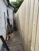 new fencing installed on side of house