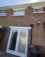 white repainted parts on house replaced upvc