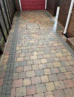 driveway power washed in front of garage