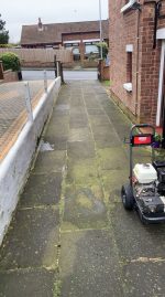 driveway path to garage dirty messy in need of cleaning power hose property maintenance